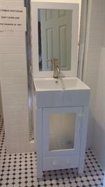 BRAND NEW NEVER USED VANITY WITH MIRROR PURCHASED FROM WINFREY.....COST $799 and selling for half price.