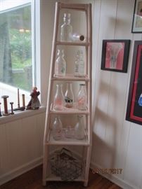 Old Milk Bottles on ladder shelf