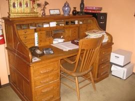 We are TAKING BIDS on this turn-of-the-century hand made roll-top desk