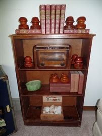  Wood bookshelf, leather books, thermal insulator,  vintage radio 