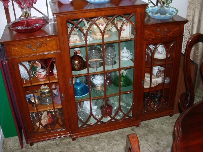 Nice antique display piece filled with beautiful glassware