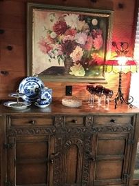 Antique sideboard, Vintage lead glass and wrought iron table lamp.
