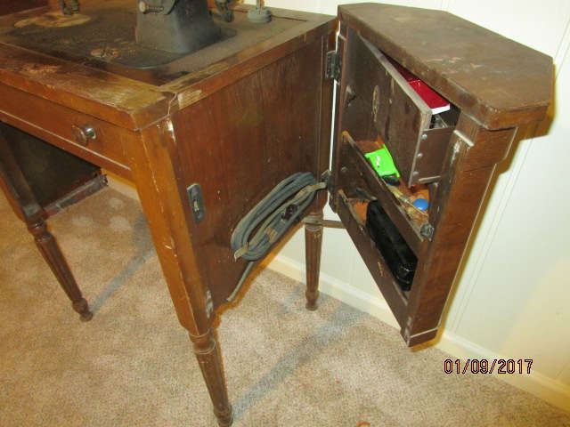 side to cabinet of White Sewing machine
