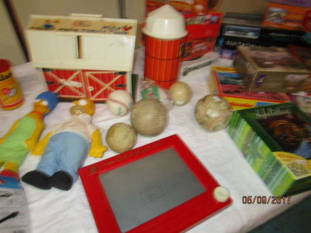 Fisher Price barn and silo, Etch a sketch, Homer and Marge Simpson dolls, etc