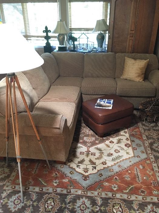 Sectional sofa, stylish and comfy.  Also a great lamp made from a surveyor's tripod