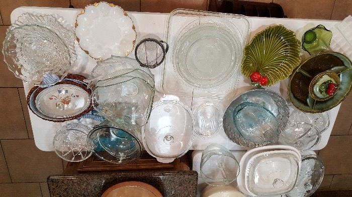 Various glass and ceramic serving dishes.