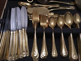 12 place gold plated flaware with many serving pieces (much more brilliant in person)