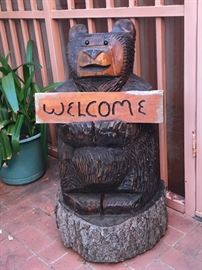 Chainsaw bear with interchangeable sign. 