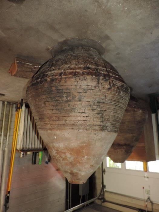 (we inverted this image) this is a LARGE oil vessel from Turkey - circa 1900 era - rare to have items like this for sale in this area !!! Made of clay ! Originally would have been buried half-way in the earth to create a natural cool/temperature to keep the oil safe.