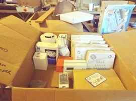 Box of HOME SECURITY CONTROLLERS, ADT, ADEMCO, and other brands