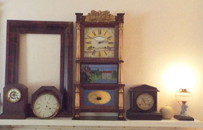 Mantel full of clocks & one beautiful antique frame