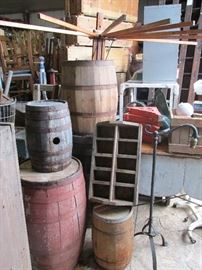Assortment of antique and vintage barrels, totes, metal lamps, antique wood drying rack