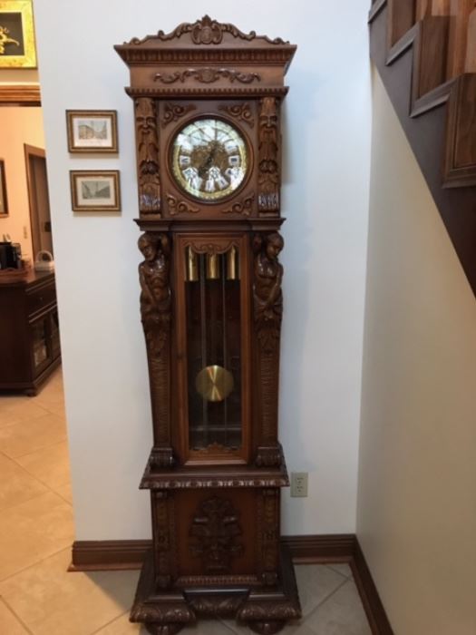 German carved tall case clock, in working condition. 