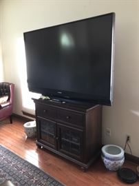 Another large tv on second cabinet