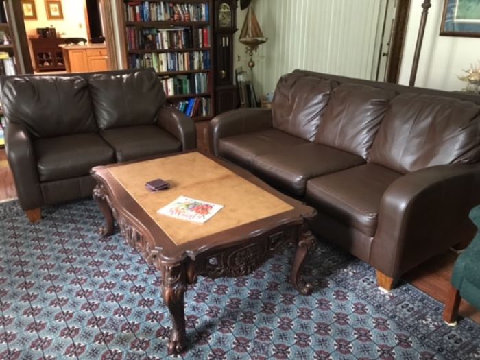 Brown leather sofa & loveseat, carved leather top coffee table