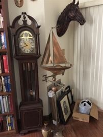 Copper & brass sailboat weather van, tall case clock, horse head.