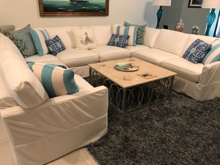 White sectional U shaped sofa by Posh Interiors 9' x 39"D. Pillows sold separately. 