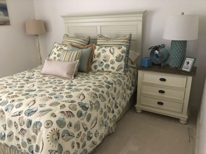 Queen size bed - Night stand  - Bedding are beach inspired. 