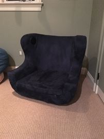 Pottery Barn iChair - features high-quality built-in speakers that are strategically positioned near your ears, and a subwoofer. There is a pocket for holding your iPod, a volume control, and stereo RCA-input jacks on the back of the chair. 34 inch x 29 inch x 30 inch,has a standard audio jack which makes it easy to connect to any game console or MP3 player.
