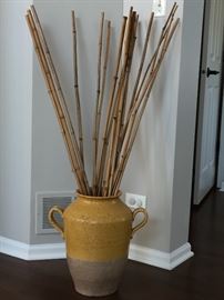 Large mustard colored pottery with bamboo sticks $75