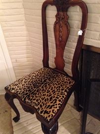 One of four matching beautifully carved antique chairs 