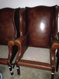 Leather wingbacks ---  waiting for upholstered cushions and a new home