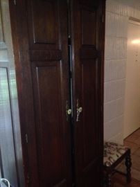 Tall and slender antique armoire
