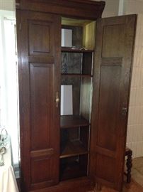 The armoire can be used for a TV or for storage.