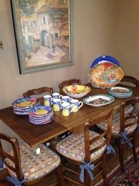 Antique draw-leaf table & 6 chairs; colorful dishes - some signed: De Simone from Italy