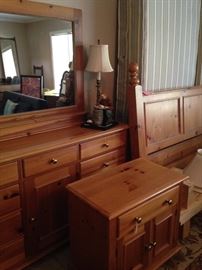 The king pine bed, nightstand, and double dresser have a matching armoire. 