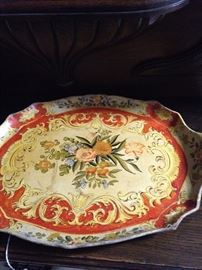 One of two similar hand-painted trays