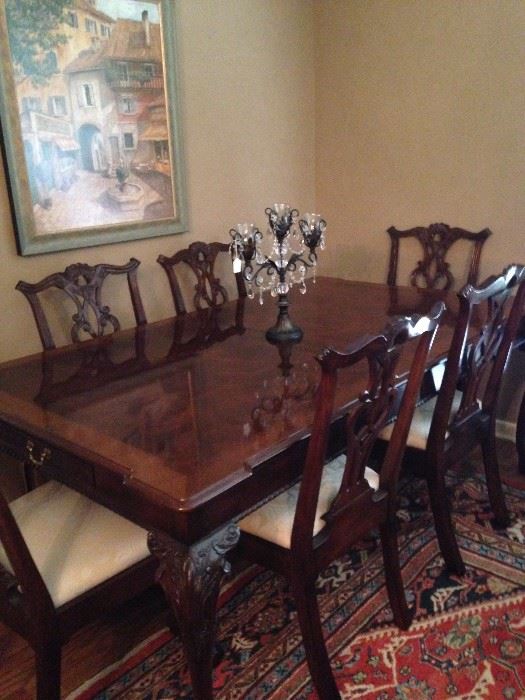 Stunning Chippendale dining table has 8 chairs and 2 (not shown) leaves .