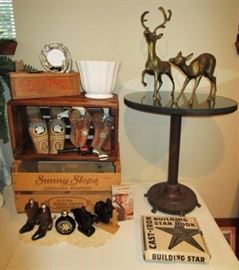 Wooden crates, cheese box, planter, metal base oval table w/ glass top, brass deer, toy guns/holsters, AVON collectibles