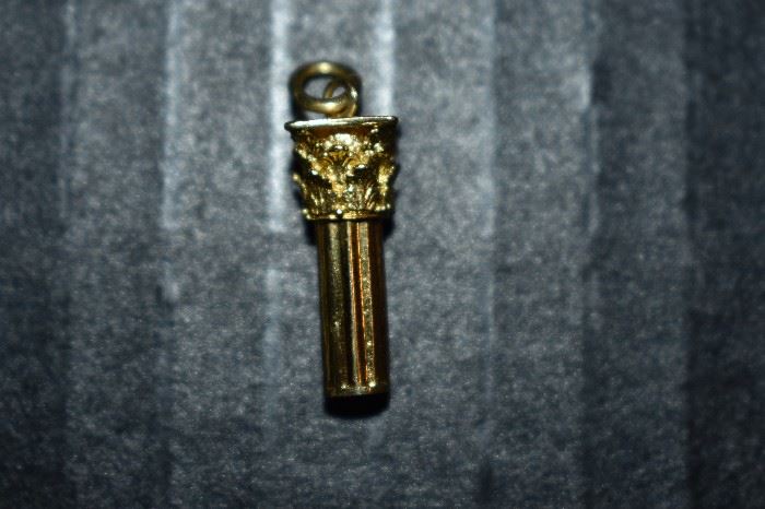Pillar Charm - One (1) 18kt yellow gold decorative pillar charm weighing approx. 1.74dwt and measures approx. 4" in length.