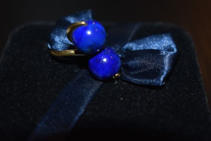 1) Lazuli Ring - One ladies 18kt yellow gold bypass style ring mounting weighing approx. 5.06dwt and is set with two (2) round lapis lazuli beads each measuring approx. 11mm in diameter.