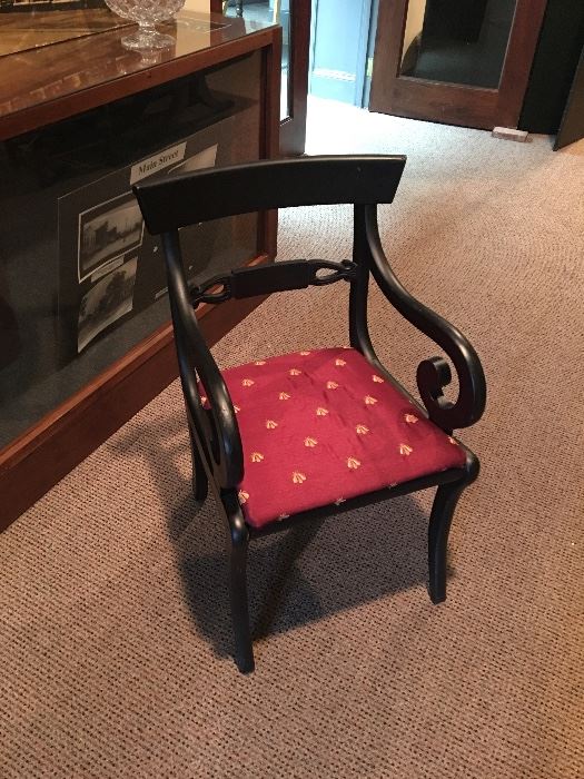 Ebonized arm chair with red and gold bee fabric
