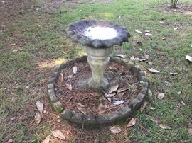 Great bird bath in yard