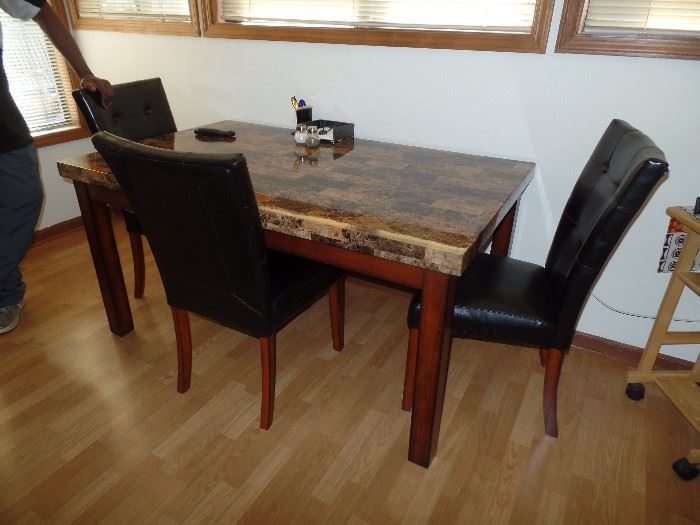 Very sleek looking Dining or Kitchen table and 4 Leather Parsons chairs