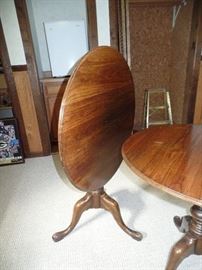 Two beautiful round Tilt- top tables