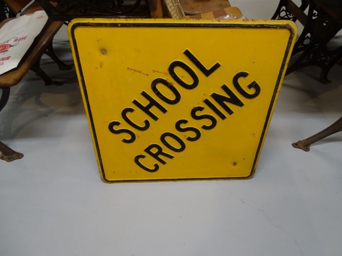Metal school crossing sign.