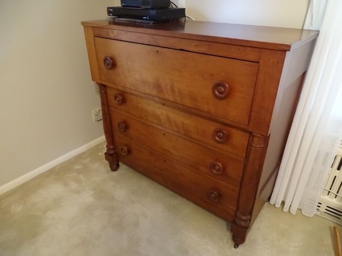 Antique cherry chest of drawers.