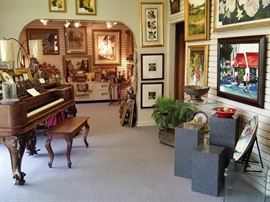 The entry of the gallery is full of beautiful custom framed oil paintings, watercolors, and engravings. Everything you see is for sale, including the displays.
