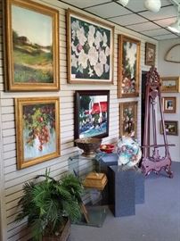 Original oils, glass cube displays, pedestals, and one of two large carved mahogany easels.
