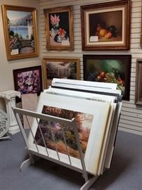 One of several gray painted wood racks for holding unframed art