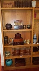 Collection of antique books and boxes.