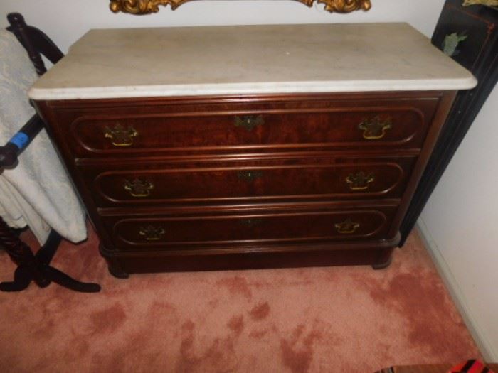 Vintage Marble top antique chest of drawers  2 foot by 3 foot.  Does have a secret drawer 