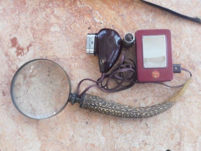 Vintage Antler magnifying glass and vintage Norelco razor