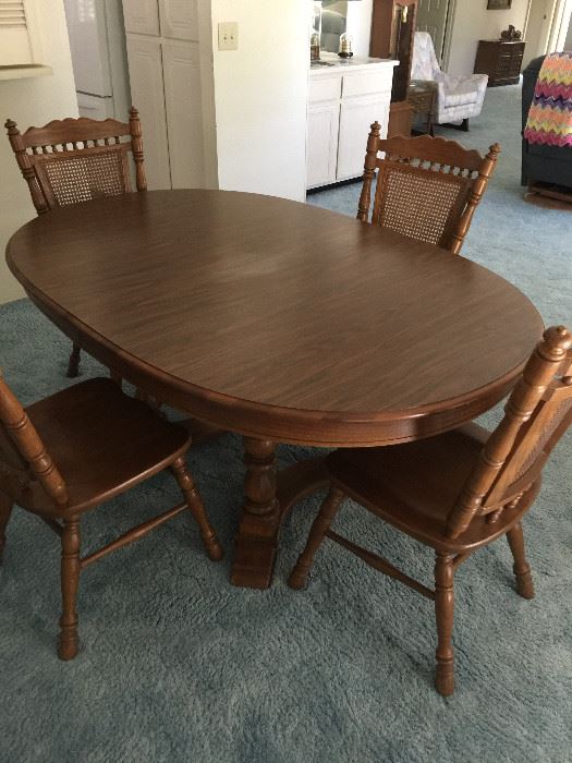 (Tell City Oak) Dining room table with 4 chairs and pads (cane backing on chairs)     Approx 44" width   85" length   29" height