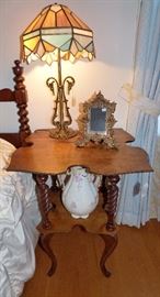 Antique cloverleaf table, slag glass iron lamp