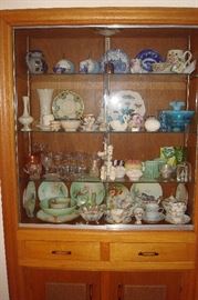 Art glass, china & collectibles in cabinet.